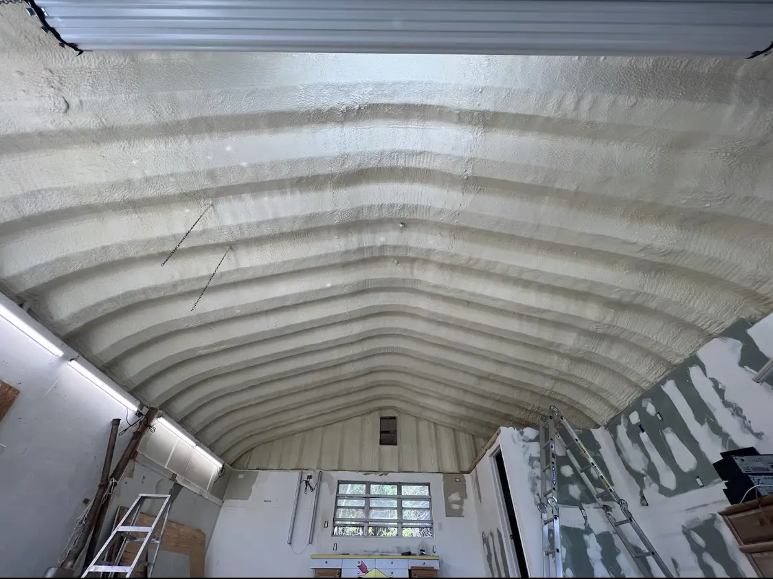 Spray polyurethane foam applied to the underside of a metal roof deck in Brooklyn Park